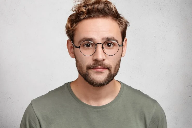 Attractive man with dark eyes beard trendy hairdo wears casual clothes spectacles 273609 8957